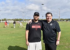 Preston Bowers volunteers for TOPSoccer, and Chris Collins manages the program.