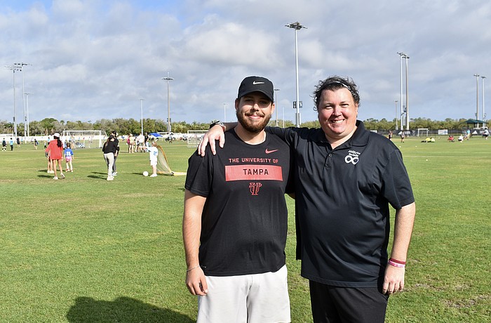 Preston Bowers volunteers for TOPSoccer, and Chris Collins manages the program.