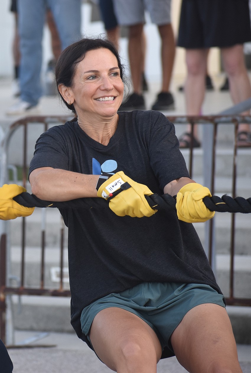 Lakewood Ranch's Sarah Brooks pulls the bus as part of the Free Agents team in support of her son Nick Lapinski. Lapinski has autism and got a job through support from Inclusion Revolution.