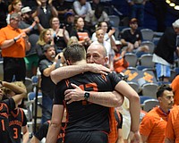 Sarasota boys basketball coach BJ Ivey embraces Johnny Lackaff. The junior guard had a game-high 27 points March 14 in the FHSAA Class 7A state championship, but it wasn't enough for the Sailors.