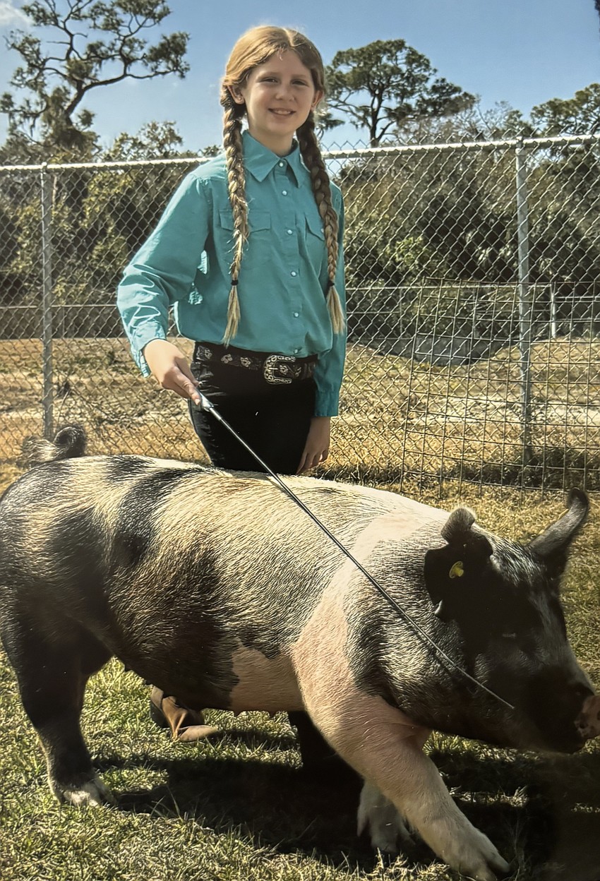 Third grader Merida Mckeehan cares for Rusty.