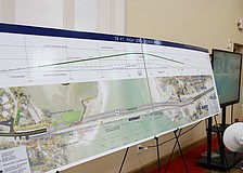 Longboat Key resident Cathy Ross looks at FDOT plans for a fixed-span bridge to replace the drawbridge currently connecting Longboat Key to Anna Maria Island at a public meeting at Christ Church Thursday, March 13.