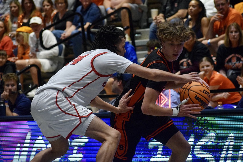 Sophomore guard Greg Dauer (right) tries to get by Felipe Quiñones (left). Dauer, who averaged 9.6 points per game this season, was held to four on 1-for-4 shooting against Columbus.