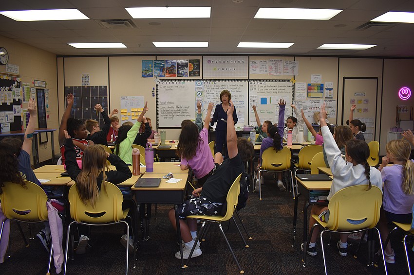 Around 160 volunteers from local businesses visited fourth grade classes across the district on March 12 as part of Project T.E.A.C.H. (“Teach Everyone About Career Horizons”) to interact with and inspire young minds.