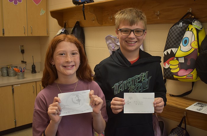 Gilbert W. McNeal Elementary School fourth graders Leona Killion and Michael Chmielarski created business cards as a dancer and a soccer player for the Project T.E.A.C.H. activity on March 12.