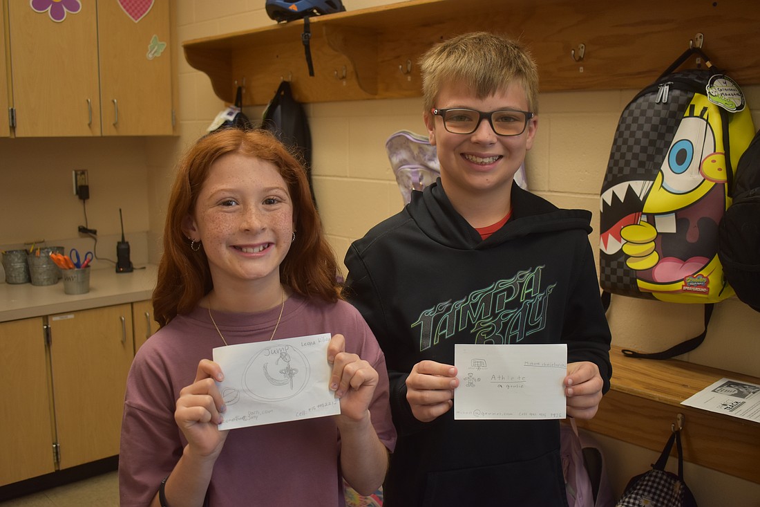 Gilbert W. McNeal Elementary School fourth graders Leona Killion and Michael Chmielarski created business cards as a dancer and a soccer player for the Project T.E.A.C.H. activity on March 12.