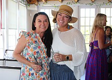 Ashley Dawson and Kristen Laviolette share what the Ladies of Longboat social group has meant to them as they greet members at the March 11 meetup at Ventura's Italian Kitchen & Wine Bar.