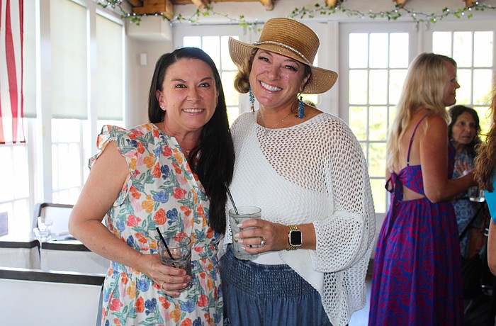 Ashley Dawson and Kristen Laviolette share what the Ladies of Longboat social group has meant to them as they greet members at the March 11 meetup at Ventura's Italian Kitchen & Wine Bar.