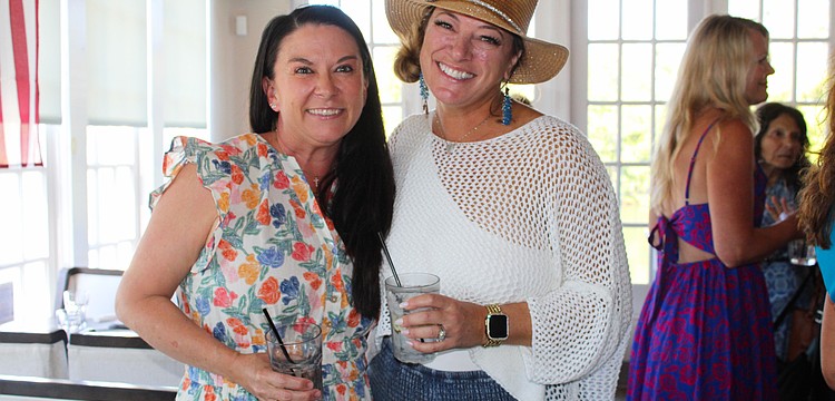 Ashley Dawson and Kristen Laviolette share what the Ladies of Longboat social group has meant to them as they greet members at the March 11 meetup at Ventura's Italian Kitchen & Wine Bar.