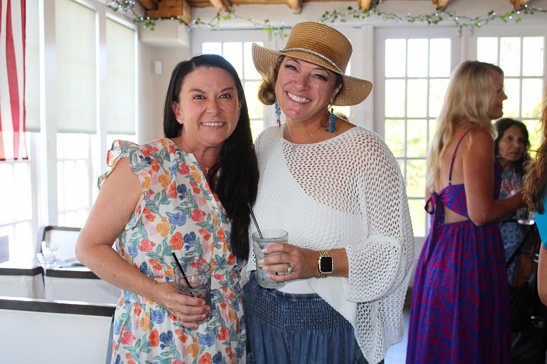 Ashley Dawson and Kristen Laviolette share what the Ladies of Longboat social group has meant to them as they greet members at the March 11 meetup at Ventura's Italian Kitchen & Wine Bar.
