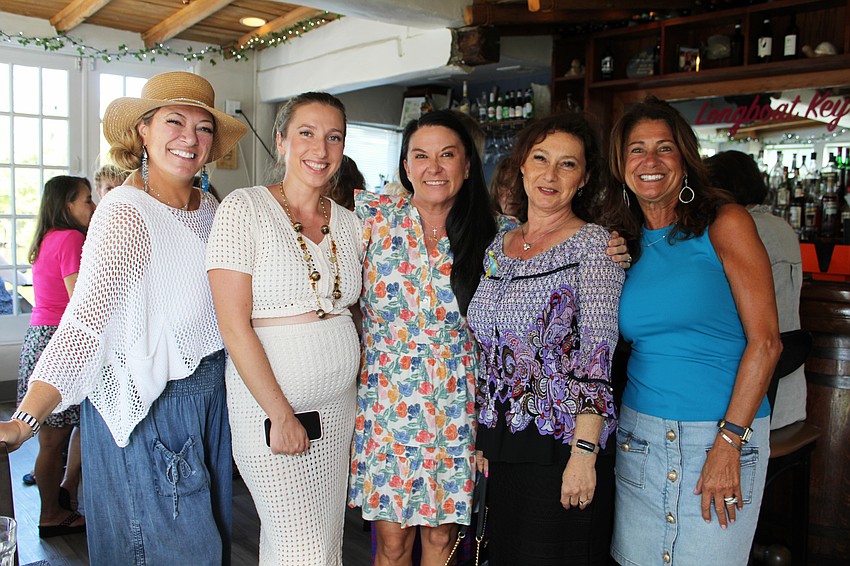 Kristen Laviolette, Anna Eliseeva, Ashley Dawson, Irina LaRose and Janice Taranto catch up at the Ladies of Longboat social hour.