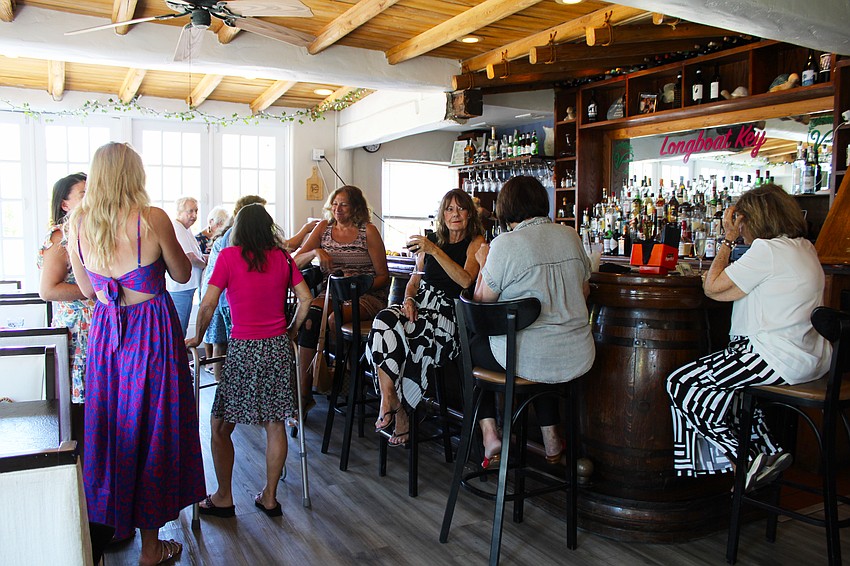 During the two-hour social meetup, Longboat Key residents cycled in and out of the restaurant, hopping among conversations.