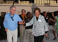 Marc and Susan Benjamin are all smiles on the dance floor as they groove to the Aloha Sharks band March 14 at The Sanctuary.