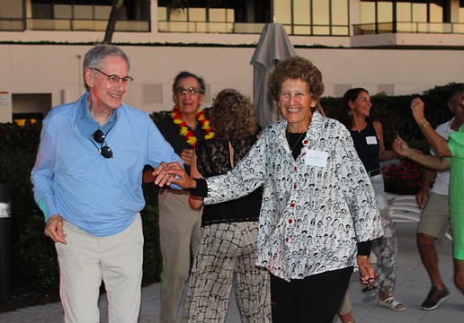 Marc and Susan Benjamin are all smiles on the dance floor as they groove to the Aloha Sharks band March 14 at The Sanctuary.
