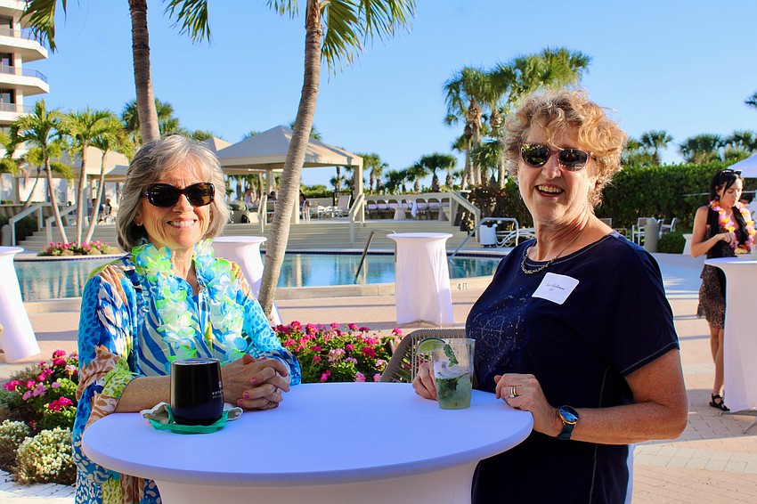 Anita Hudepohl and Kate Glickman enjoy a poolside chat at The Sanctuary's annual outdoor bash on March 14.