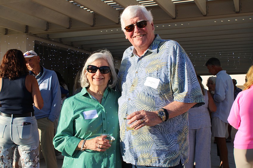 Helene and Doug Romine take in some sunshine at the pool party.