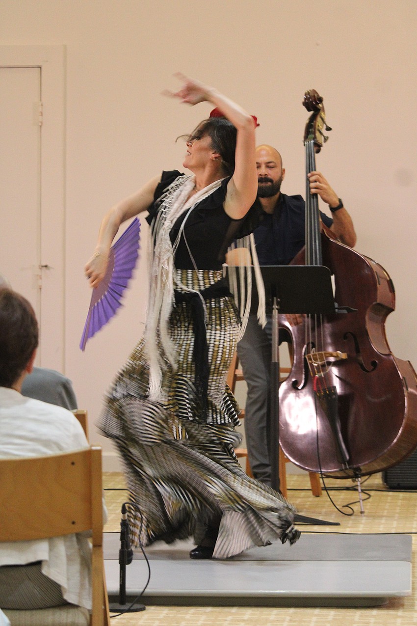 Flamenco dancer Carolina Esparza uses a fan and lengthy shawl to accentuate her choreography.