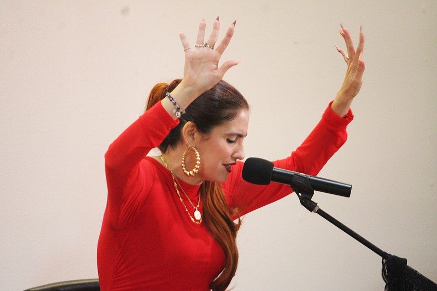Singer Sara Verse embraces the moment at the March 15 performance by Los Rumberos.