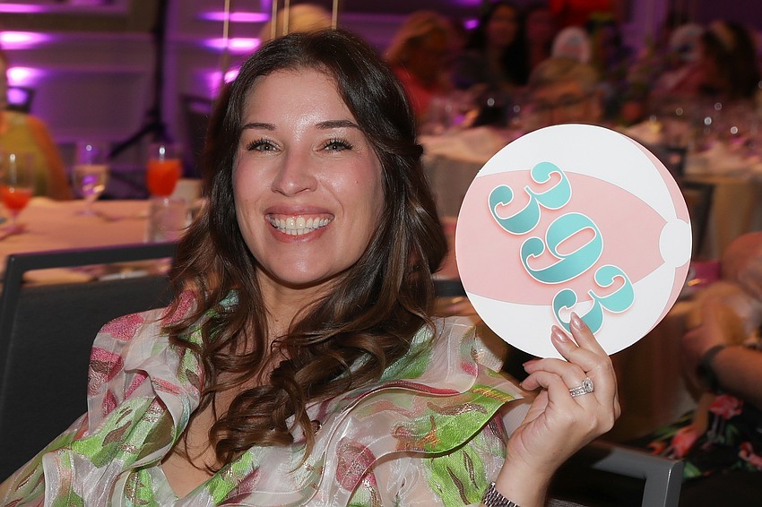 Emily Pizarro gets the auction started.