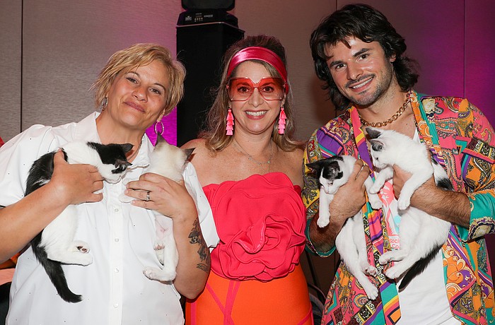 Samantha Varnam, Jamie Marco and James LaLonde show off some sleepy kittens.