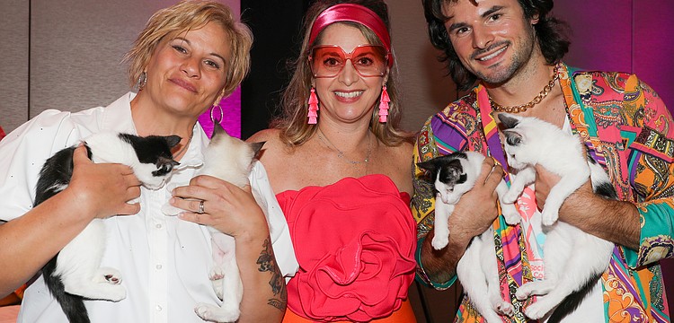 Samantha Varnam, Jamie Marco and James LaLonde show off some sleepy kittens.