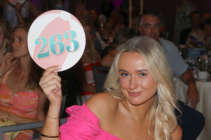 Cailyn Yarber makes a donation.