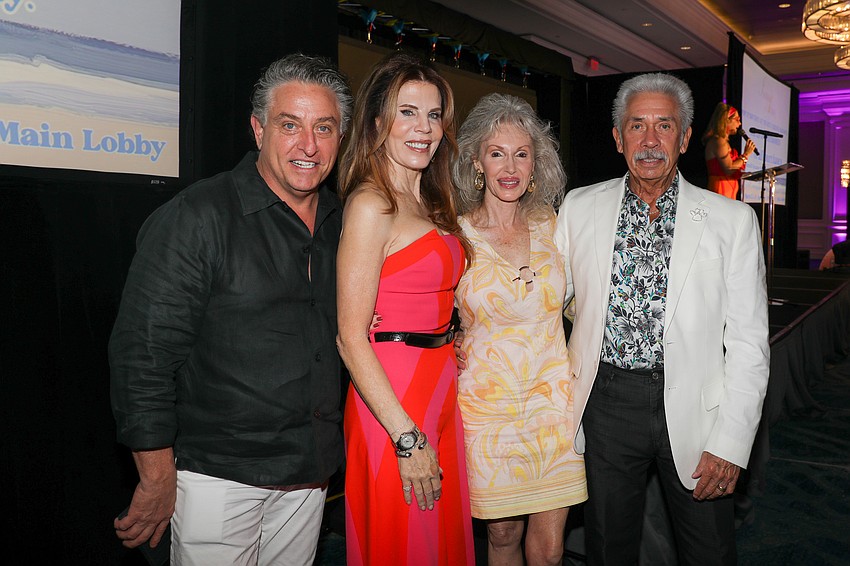 Glen Rieth and Renee Phinney celebrate with Louise and Bruce Ginsberg who won the drawing for the great gift basket.