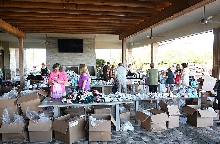 Esplanade residents have an assembly line to stuff Comfort Cases backpacks to be delivered to foster kids.