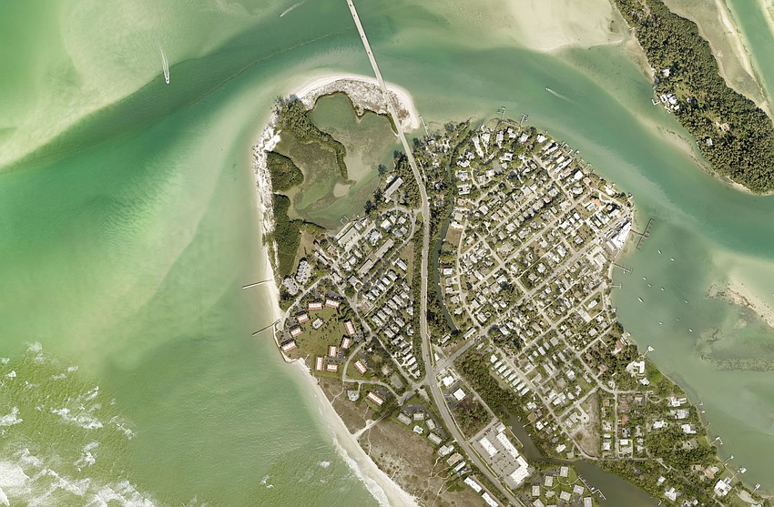A satellite image shows the north end of Longboat Key in 2020. Sand is heavily eroded from Greer Island (Beer Can Island), a popular beach for beachgoers and boaters.