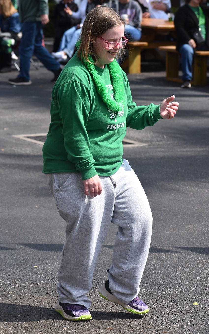 Bridget Browne of Buffalo, New York can't help but dance to the tunes of the White Crowe band on St. Patrick's Day.