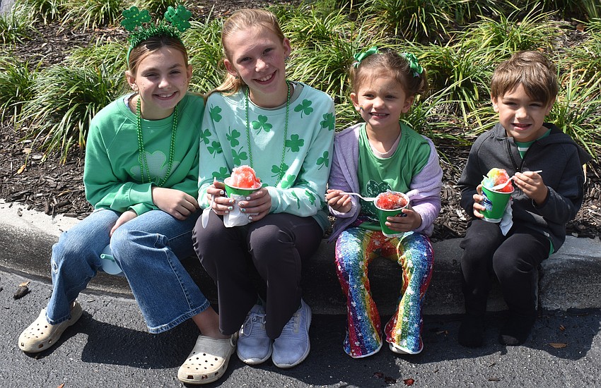 Lakewood Ranch's Matty Favero, Olivia Zeller, Alora Stone and Keller Favero take a Kona Ice break from the St. Patricks Day festivities.