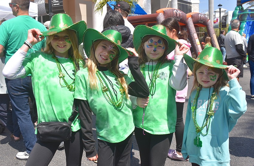 Paiten Moody, Chloe Moody, Piper Bates and Harper Bates model their sparkly hats they describe as 