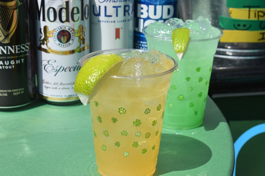Attendees of the St. Patrick's Day celebration on Lakewood Main Street are able to enjoy Irish-themed mixed drinks and beers to celebrate the holiday.