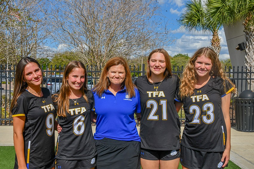 TFA’s head coach Nikki Thorndill, center, is in her third year as a coach. She’s watched the girls grow from young, fresh lacrosse players to experienced professionals.