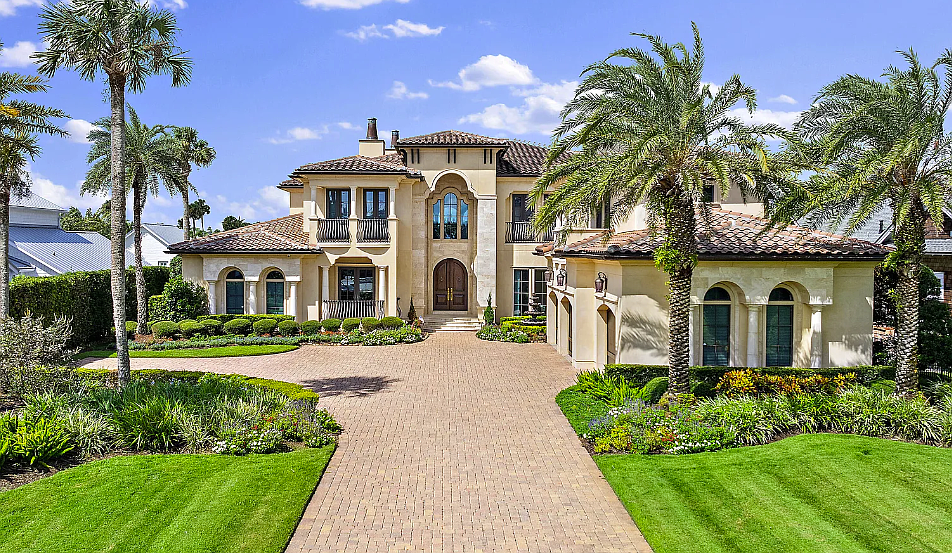 Mediterranean-style, two-story home with golf views features five bedrooms, six full and three half bathrooms, a guest suite, office, theater, elevator, wine cellar, porches, patios, pool and an outdoor kitchen.