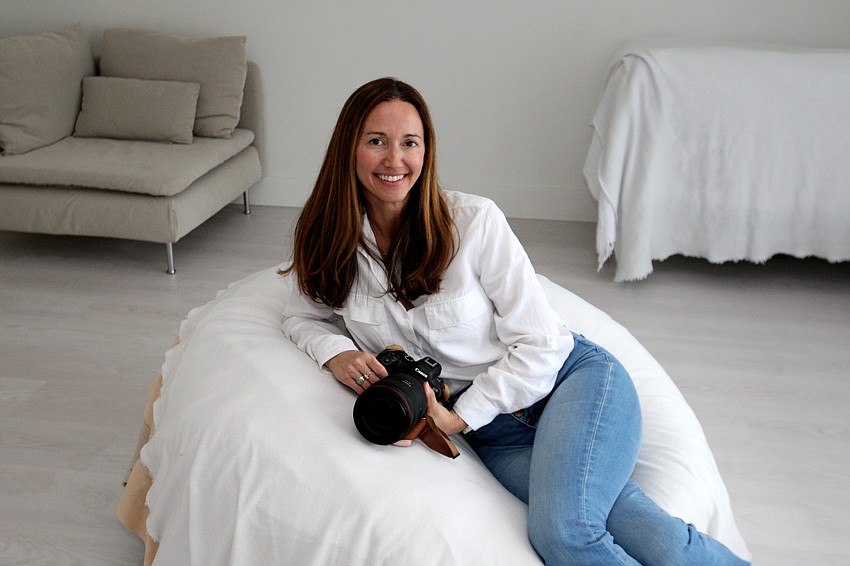 After struggling to find local resources to capture photos of her family and young children, Davis started her own company, offering new mothers the opportunity to preserve those early moments through her photography business.