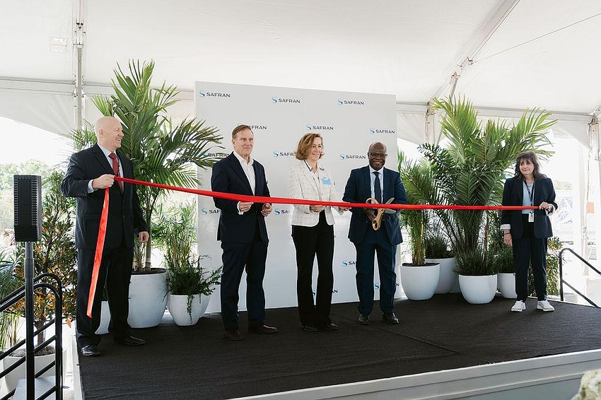 Executives cut the ribbon at the expanded Safran Electrical & Power facility in south Manatee County. Executives cut the ribbon at the expanded Safran Electrical & Power facility in south Manatee County.