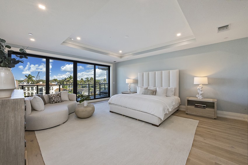 A photo of the primary bedroom suite inside the penthouse of the luxury La Pele condominiums in Naples. A photo of the primary bedroom suite inside the penthouse of the luxury La Pele condominiums in Naples.