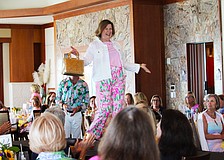 Mary Schultz shows off the latest Lilly Pulitzer style on the St. Mary, Star of the Sea, Women's Guild spring fashion show March 16 at the Sarasota Yacht Club.