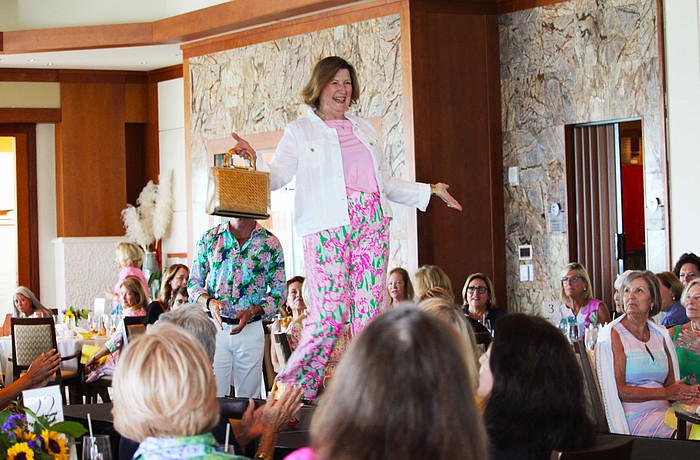 Mary Schultz shows off the latest Lilly Pulitzer style on the St. Mary, Star of the Sea, Women's Guild spring fashion show March 16 at the Sarasota Yacht Club.