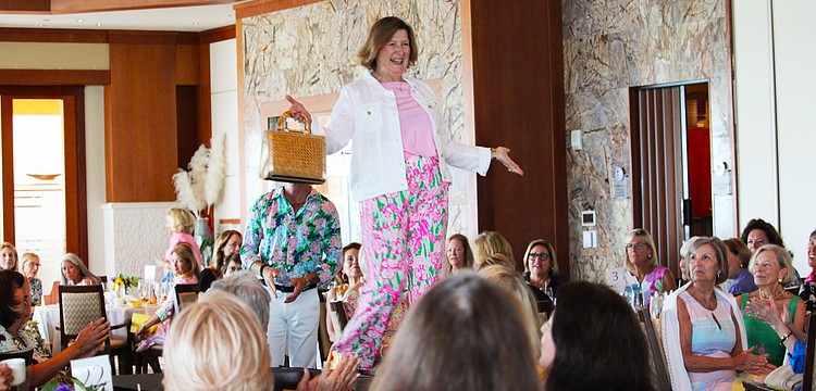 Mary Schultz shows off the latest Lilly Pulitzer style on the St. Mary, Star of the Sea, Women's Guild spring fashion show March 16 at the Sarasota Yacht Club.