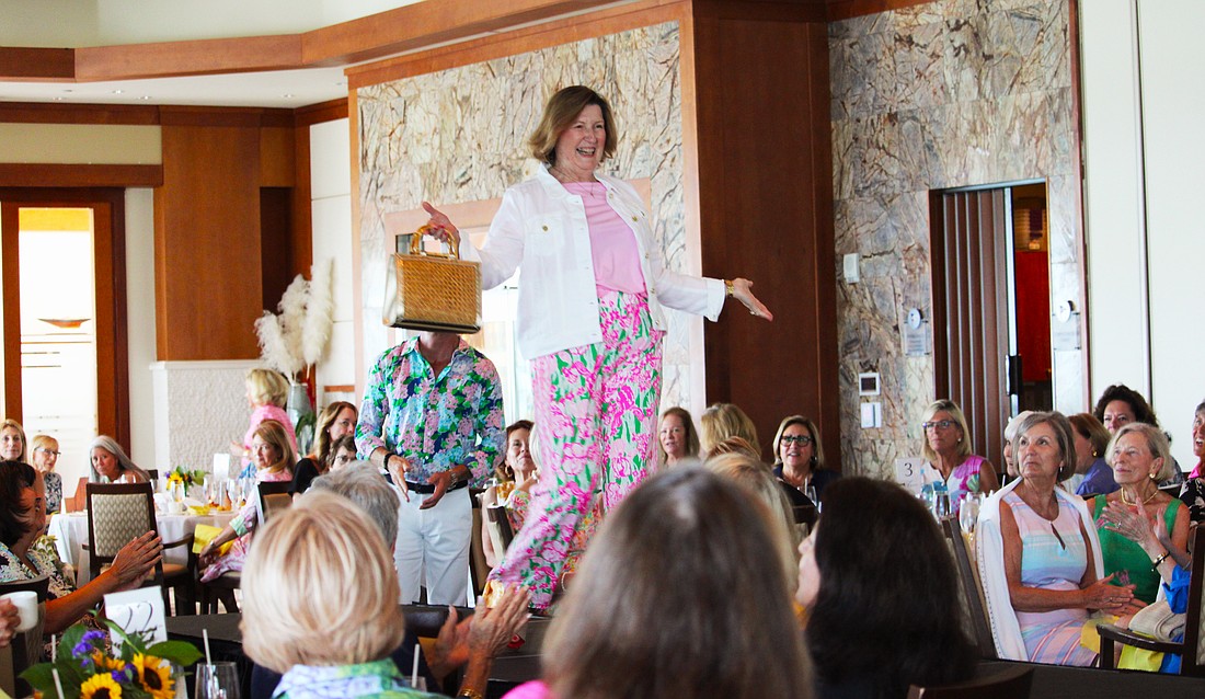 Mary Schultz shows off the latest Lilly Pulitzer style on the St. Mary, Star of the Sea, Women's Guild spring fashion show March 16 at the Sarasota Yacht Club.