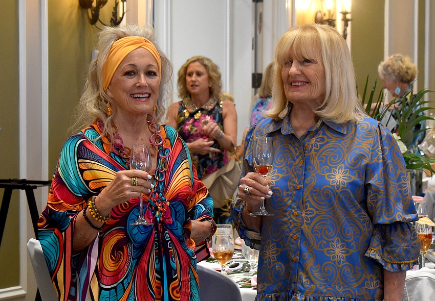 Sarasota's Bev Cavazzi and Lakewood Ranch's Bonnie Femec socialize before the Divas and Dogs fashion show begins.