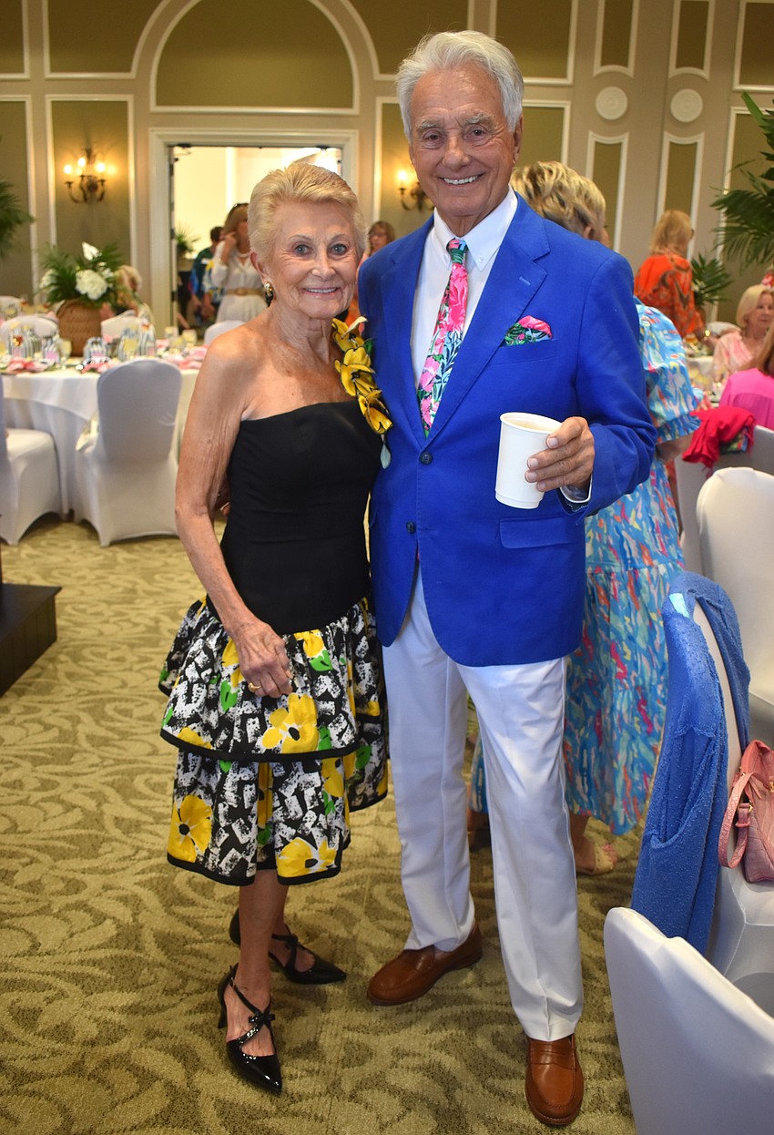 Usually a model for Divas and Dogs, Mary Jo Hansen wears a 40-year-old dress while supporting The Humane Society at Lakewood Ranch. Paul Giroux came in support of his wife, Susan Giroux, who is chair of Divas and Dogs.