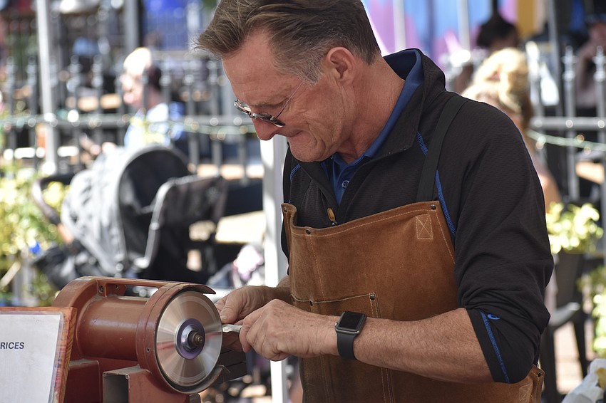 Thierry Rouillard of American Eagle Knife Sharpening demonstrates his services.