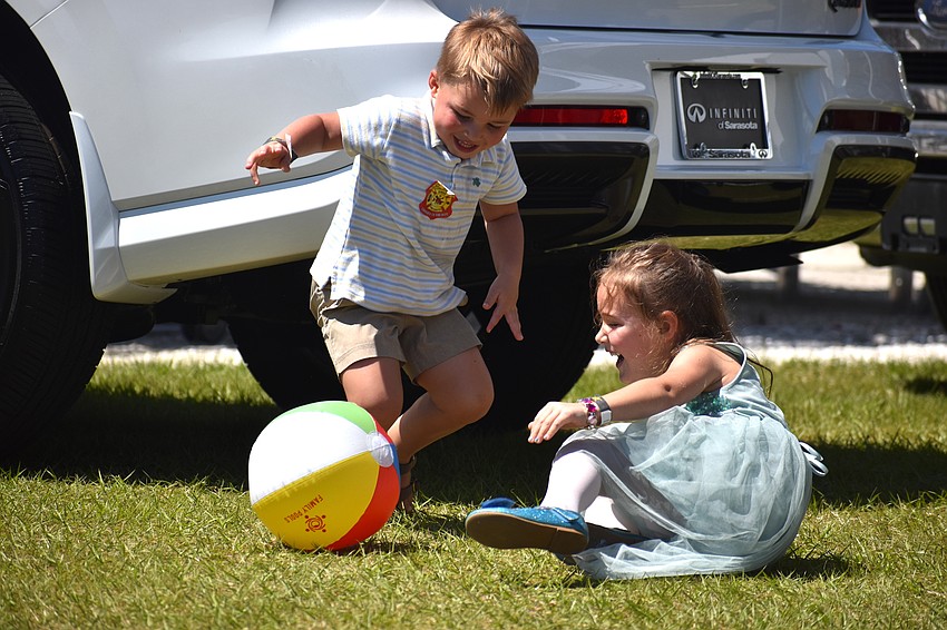 Tifton, Georgia's Oliver Carroll, 4, and Palmetto's Ella Gritt, 4, play soccer with a beach ball at My Hometown Fest on March 21.