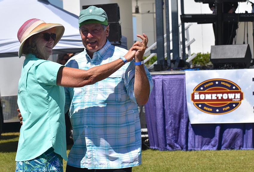 Sarasota's Marie and Herb Hadden dance to Sweet Fleet, a Fleetwood Mac cover band, at My Hometown Fest on March 21.