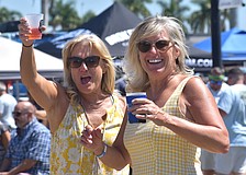 Sarasota's Tracy Tutton and Tania Cook, sisters from Canada, enjoy drinks while listening to Sweet Fleet at My Hometown Fest on March 21.