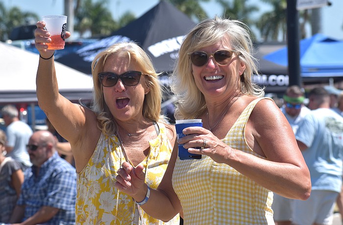 Sarasota's Tracy Tutton and Tania Cook, sisters from Canada, enjoy drinks while listening to Sweet Fleet at My Hometown Fest on March 21.
