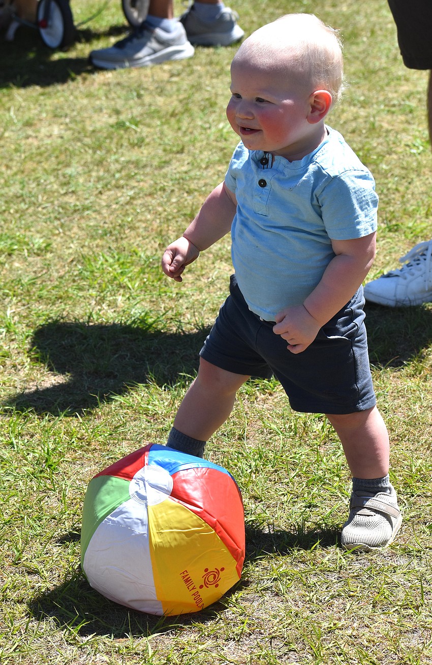 Sarasota 1-year-old Jack Butler enjoys throwing a beach ball at My Hometown Fest March 21.